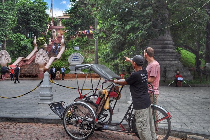 Hidden Phnom Penh City Tour, Royal Palace, Wat Phnom - Independence Monument and the city ride: where the guide adds meaning