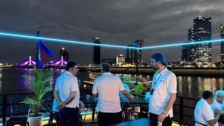 Phnom Penh: Sunset Dinner Cruise with English Speaking Guide - Stilted houses, fishing villages, and crops along the shore