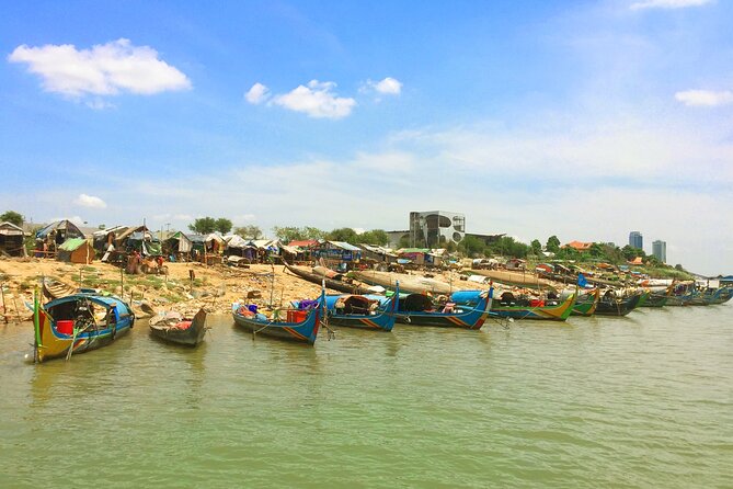Sunset Cruise with free flow beer, soft drinks & fruit platter - Cruise views: Royal Palace, bridges, and the Phnom Penh skyline from the water
